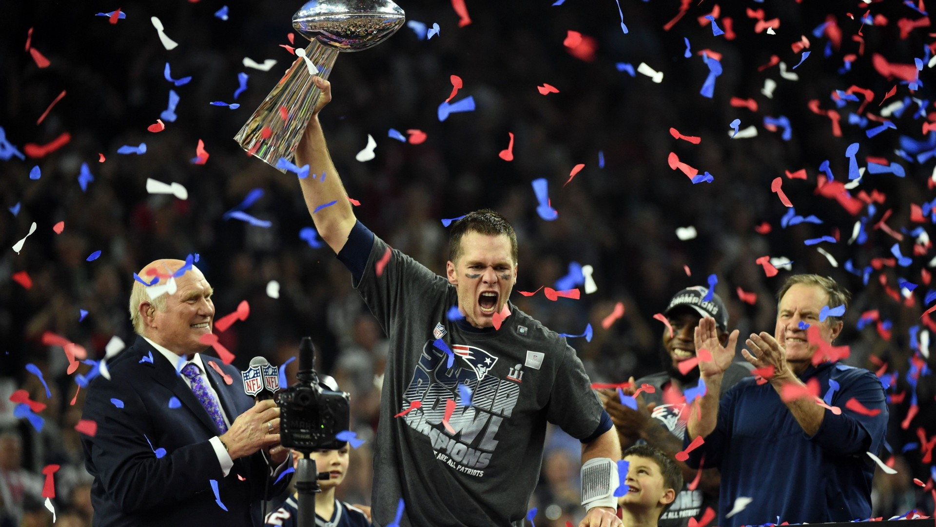 Tom Brady yelling with the Super Bowl trophy